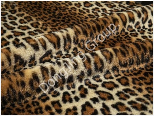 Unleashing Wild Elegantiae: Apprehende Appeal Chic of Beige Indian Leopard Print Faux Fur Fabric.